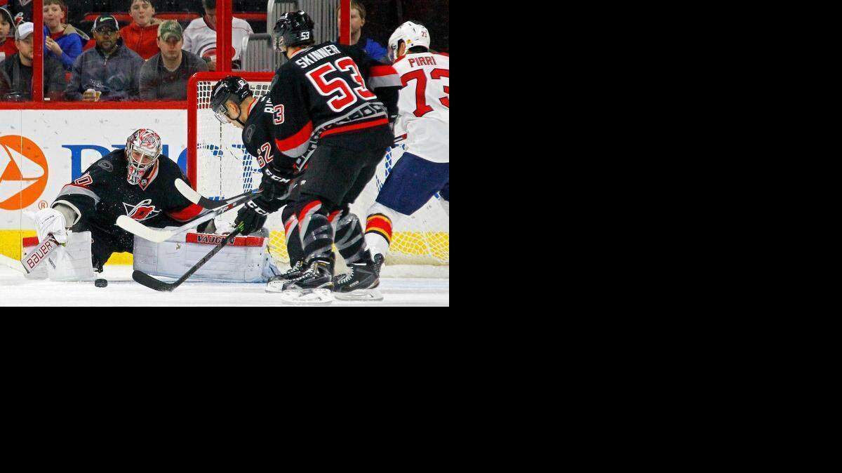 
The Canes Cam Ward (30), Rasmus Rissanen (62) and Jeff Skinner (53) defend the goal against the Florida Panthers’ Brandon Pirri (73) during the first period between the Carolina Hurricanes and the Florida Panthers at PNC Arena in Raleigh on Saturday.


