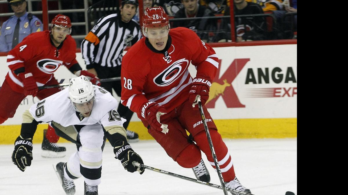 
Carolina Hurricanes' Alexander Semin (28) keeps the puck from the Pittsburgh Penguins' Brandon Sutter (16) during their game at PNC Arena in Raleigh on October 28, 2013. 
