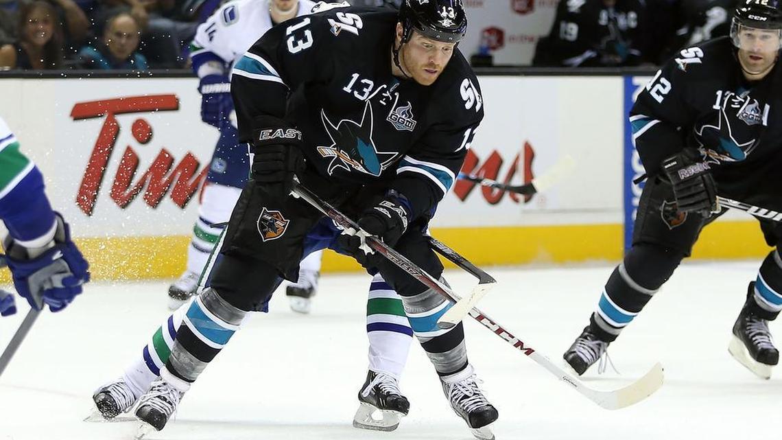 Raffi Torres #13 of the San Jose Sharks skates with the puck in Game Four of the Western Conference Quarterfinals against the Vancouver Canucks during the 2013 NHL Stanley Cup Playoffs at HP Pavilion on May 7, 2013 in San Jose, California. Torres currently is working out with the Carolina Hurricanes, hoping to land a spot on the team.