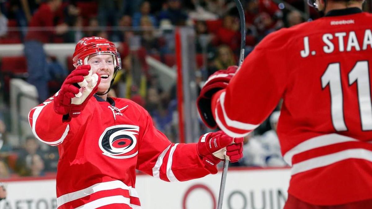 The Carolina Hurricanes' Joakim Nordstrom (42) celebrates with Jordan Staal (11), who gave him the pass, after he scored a shot handed goal during the first period of an NHL game played between the Carolina Hurricanes and the Tampa Bay Lightning at PNC Arena in February.