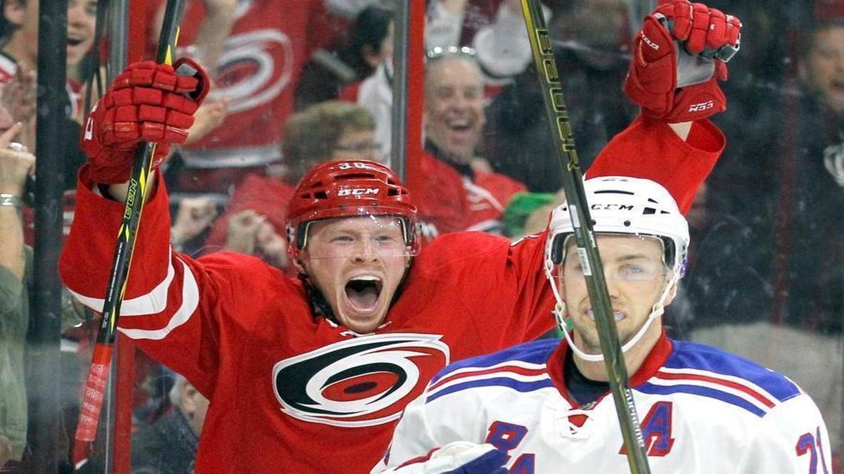 The Carolina Hurricanes' Patrick Brown (36) celebrates his goal in front of the Rangers Derek Stepan (21) during the first period of an NHL game played between the Carolina Hurricanes and the New York Rangers at PNC Arena in Raleigh, N.C. on 2016. It was Brown's first NHL goal.