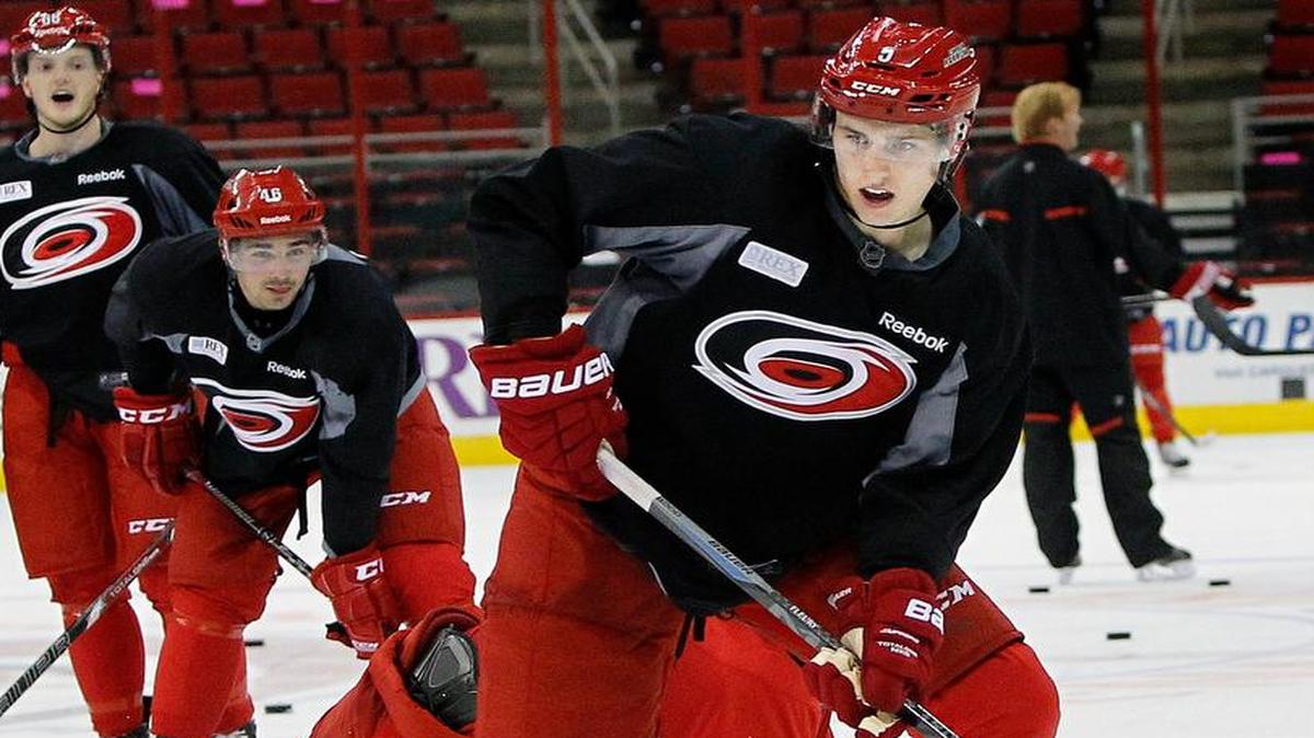 
Haydn Fleury moves the puck during the Carolina Hurricanes development camp held at the PNC Arena in Raleigh, N.C. on July 24, 2014. He was the Canes top pick in this year's draft.

