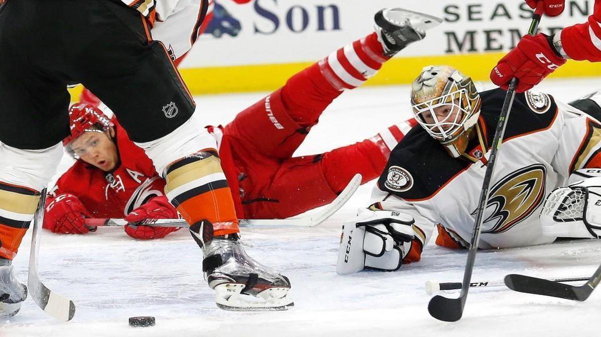 The Canes’ Jeff Skinner and the Anaheim Ducks' Jonathan Bernier keep their eyes on the puck during the first period at the PNC Arena in Raleigh.