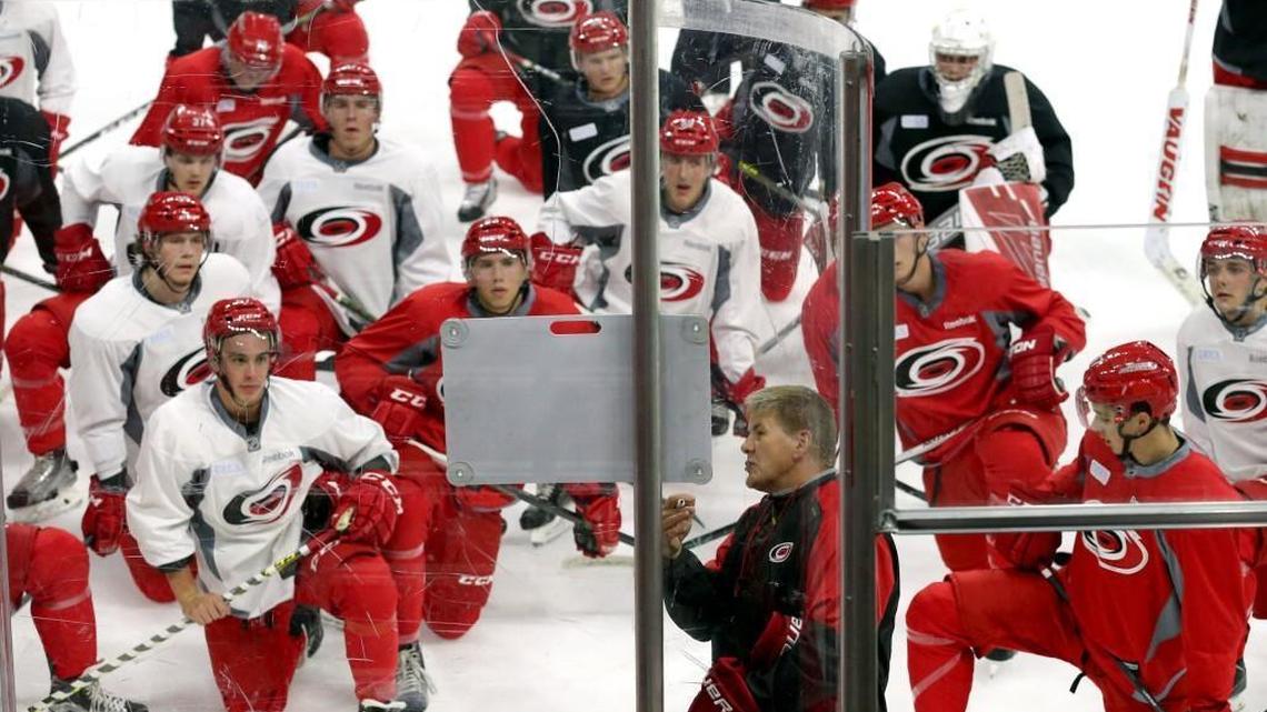 Head coach Bill Peters diagrams a drill for the players as the Carolina Hurricanes hold their prospect camp at PNC Arena in Raleigh, N.C. on July 6, 2016.