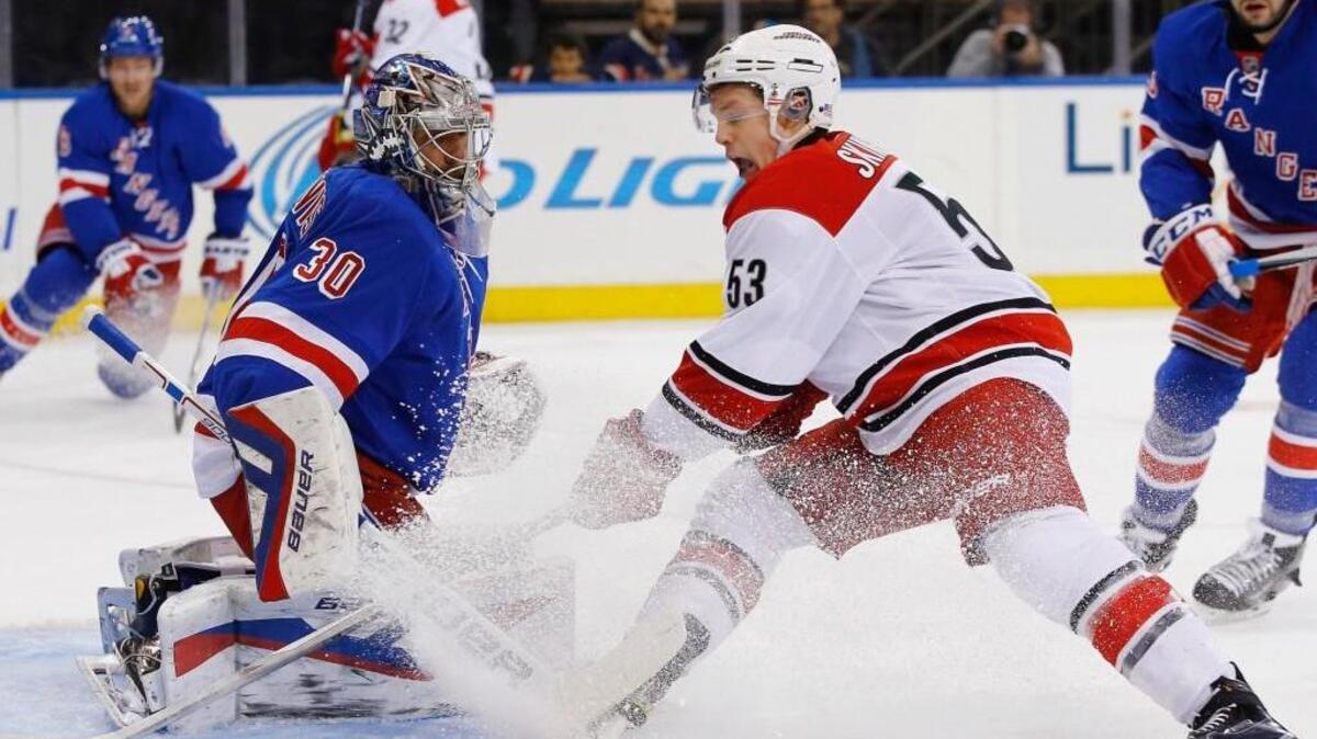 NEW YORK, NY - NOVEMBER 10: Henrik Lundqvist #30 of the New York Rangers defends against Jeff Skinner #53 of the Carolina Hurricanes during their game at Madison Square Garden on November 10, 2015 in New York City.