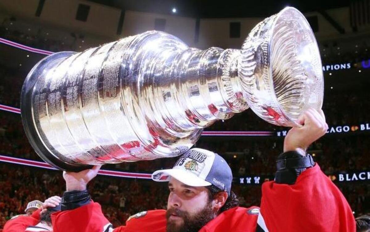 
Corey Crawford of the Chicago Blackhawks celebrates with the Stanley Cup after defeating the Tampa Bay Lightning by a score of 2-0 in Game Six to win the 2015 NHL Stanley Cup Final at the United Center on June 15, 2015 in Chicago, Illinois.
