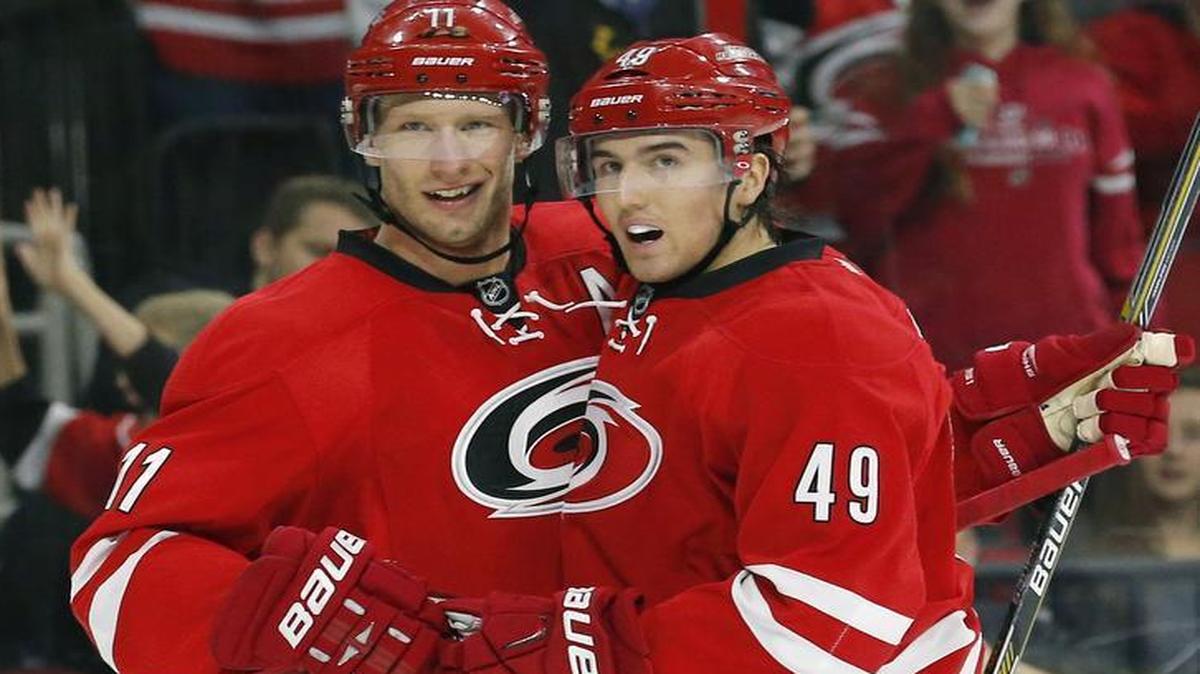 The Carolina Hurricanes' Victor Rask (49) celebrates his goal with Jordan Staal (11) during the first period of an NHL game played between the Carolina Hurricanes and the New Jersey Devils at PNC Arena in March.