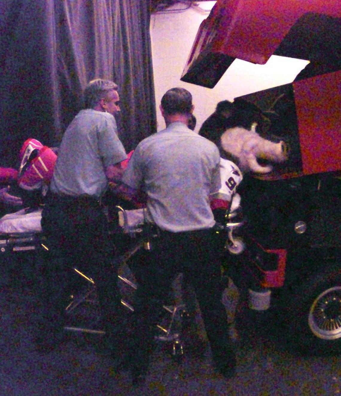 EMS workers help Phil Madren get out of the Zamboni from which he was supposed to make a surprise entrance appearance as the Hurricanes new mascot Stormy. Madren had a seizure and was taken to a hospital, where he was treated and released.