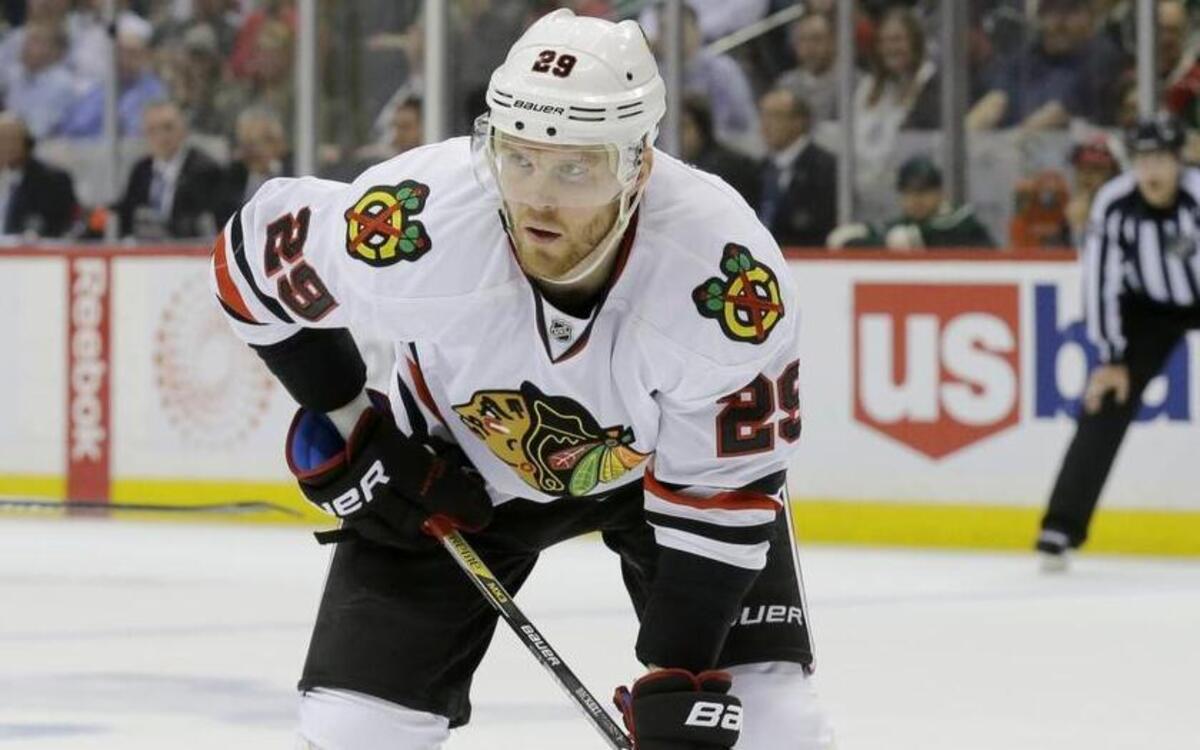 In this May 5, 2015, file photo, Chicago Blackhawks left wing Bryan Bickell (29) gets into position for a face-off during the second period of Game 3 in the second round of the NHL Stanley Cup hockey playoffs against the Minnesota Wild in St. Paul, Minn. The Carolina Hurricanes have acquired forwards Teuvo Teravainen and Bryan Bickell from the Chicago Blackhawks in exchange for two draft picks. (AP Photo/Ann Heisenfelt, File)