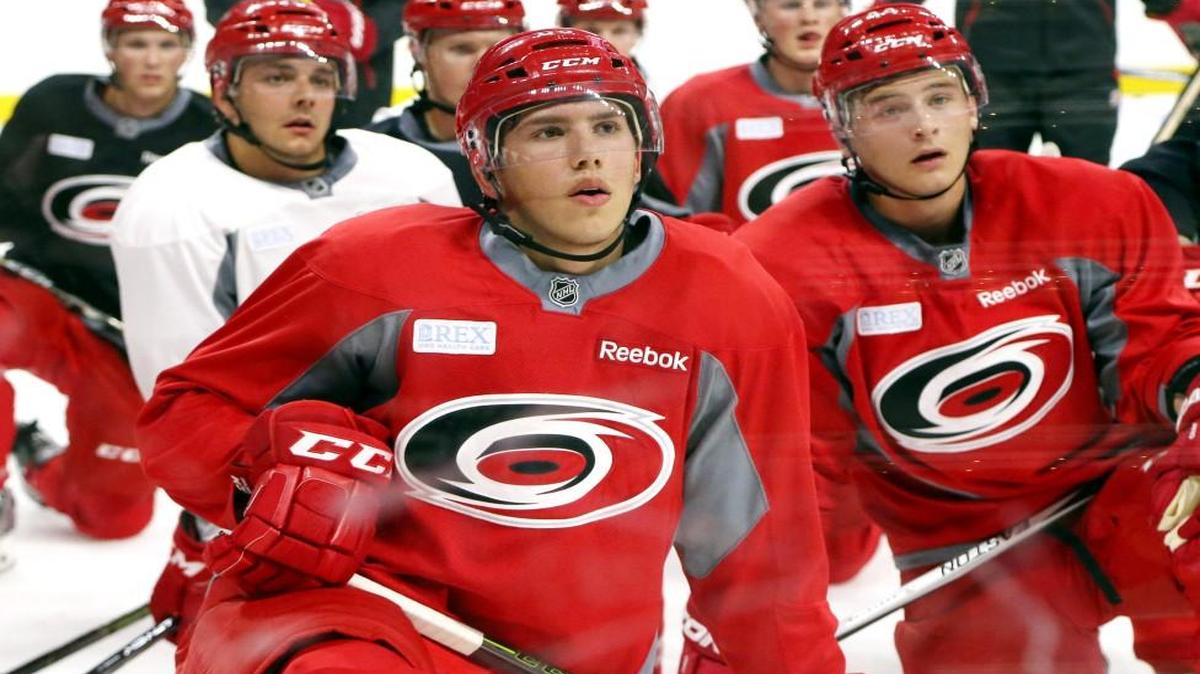 David Cotton (83), front, left, listens as a drill is explained during the Carolina Hurricanes’ prospect camp at PNC Arena in Raleigh on July 6, 2016.