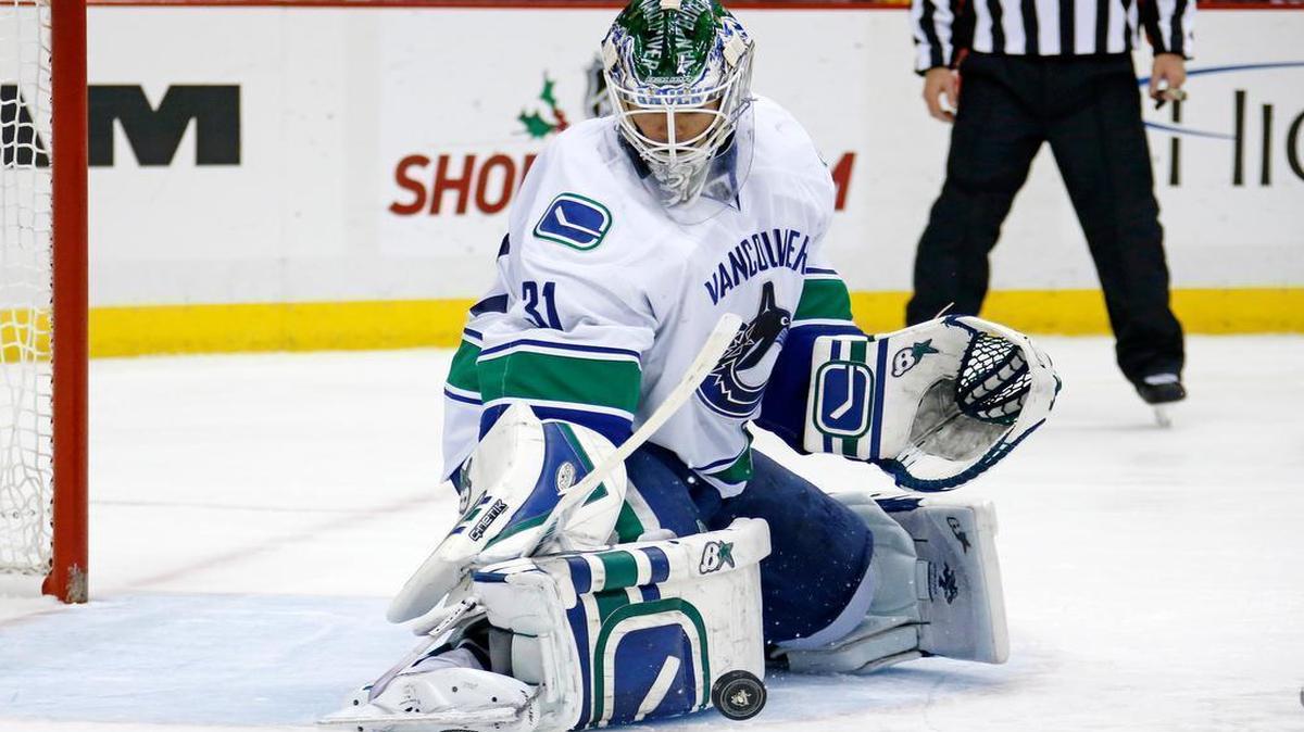 
Vancouver Canucks goalie Eddie Lack makes a pad save against the Pittsburgh Penguins on Dec. 4, 2014. The Hurricanes acquired Lack on June 27 in exchange for two draft picks.
