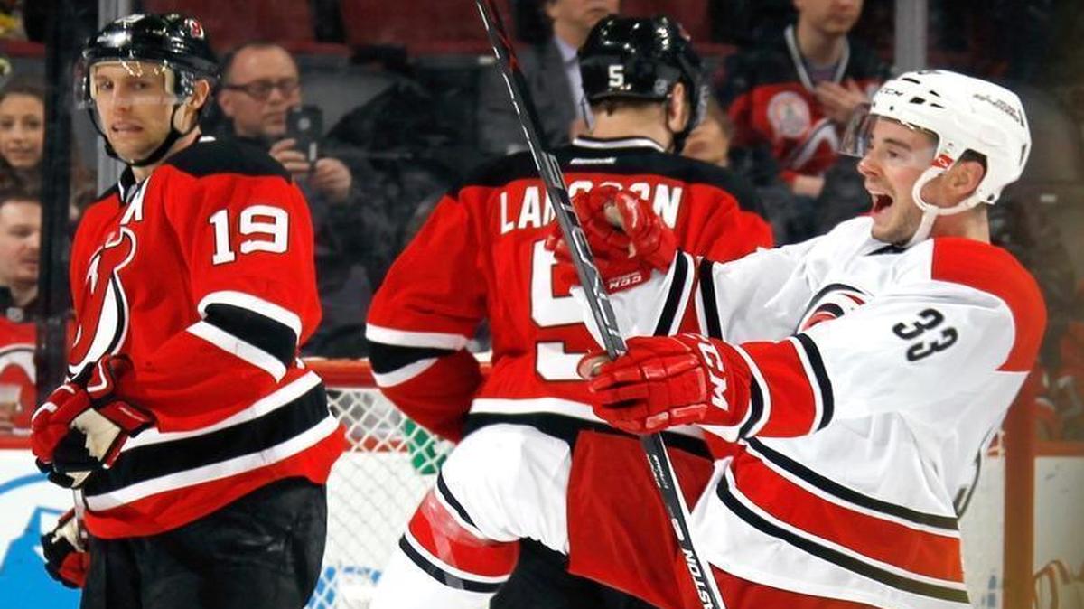 Derek Ryan (33) of the Carolina Hurricanes makes his NHL debut against the New Jersey Devils and celebrates his first NHL goal at 4:36 of the second period on the powerplay at the Prudential Center in Newark, New Jersey.
