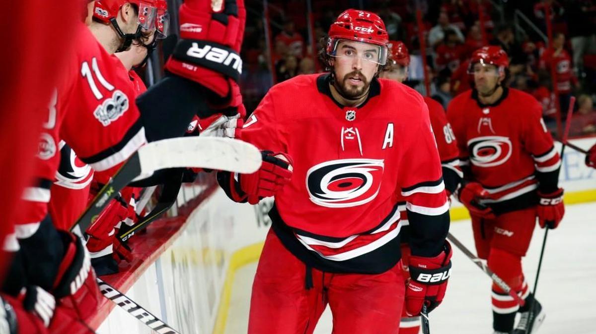 The Canes' Justin Faulk (27) comes back to the bench after he scored during the second period against the Anaheim Ducks at PNC Arena in Raleigh on Oct. 29, 2017.