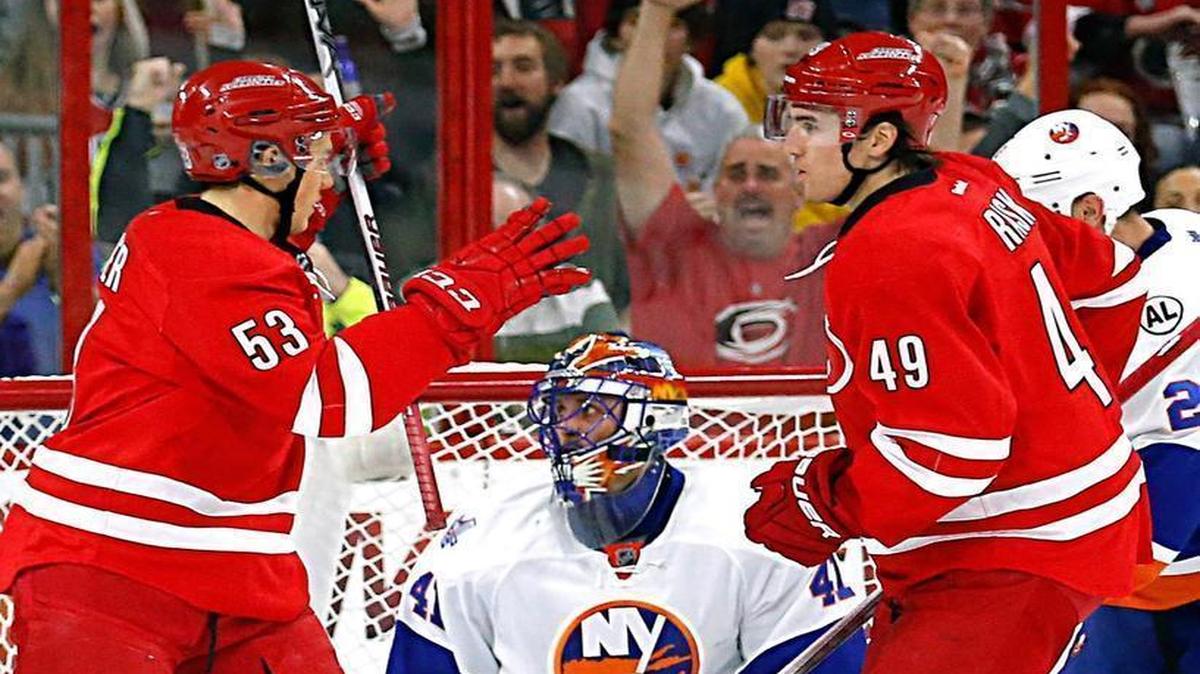 The Canes Victor Rask (49) celebrates his second goal with Jeff Skinner (53) during the second period against the New York Islanders at the PNC Arena in Raleigh.
