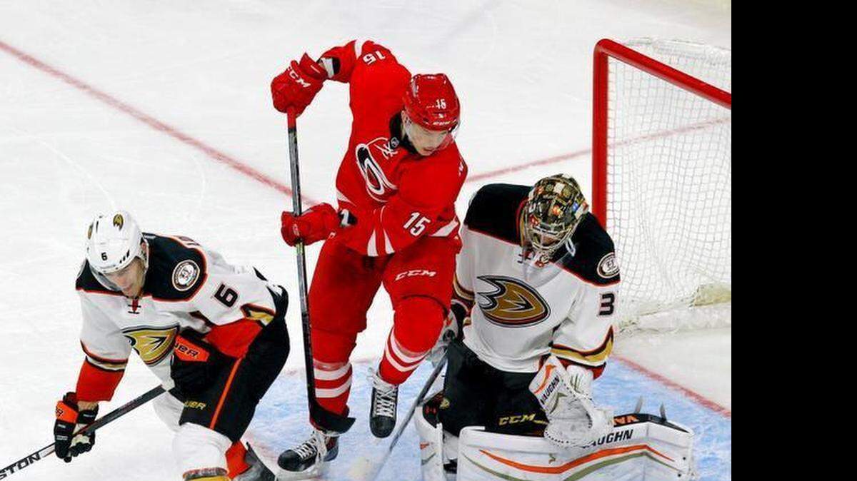 
The Canes Andrej Nestrasil (15) works against the Ducks Ben Lovejoy (6) and John Gibson (36) during the third period of an NHL game played between the Carolina Hurricanes and the Anaheim Ducks at PNC Arena in Raleigh, N.C. on Feb. 12, 2015. 
