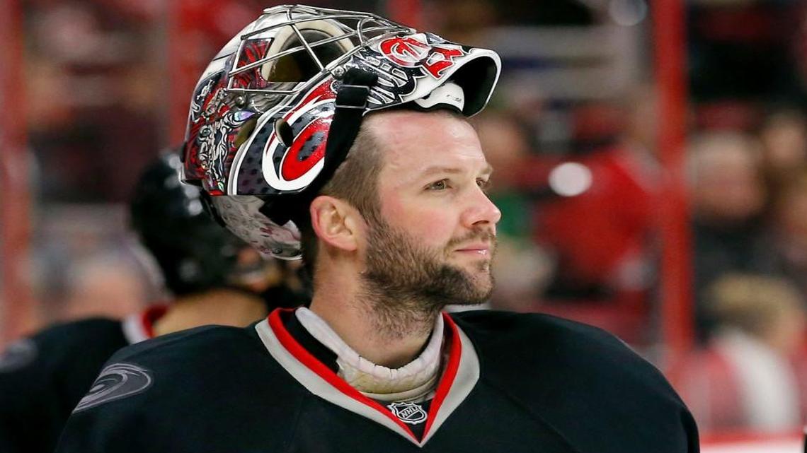 The Canes Cam Ward (30) takes a break during an NHL game played between the Carolina Hurricanes and the Vancouver Canucks at the PNC Arena in Raleigh, N.C. on Jan. 15, 2016.