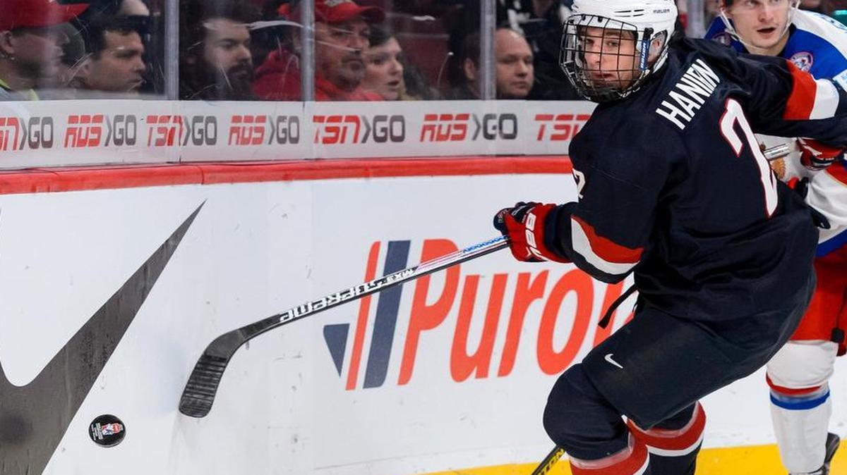 
Noah Hanifin #2 of Team United States goes after the puck behind the net in a quarterfinal round during the 2015 IIHF World Junior Hockey Championships against Team Russia at the Bell Centre on January 2, 2015 in Montreal, Quebec, Canada. 
