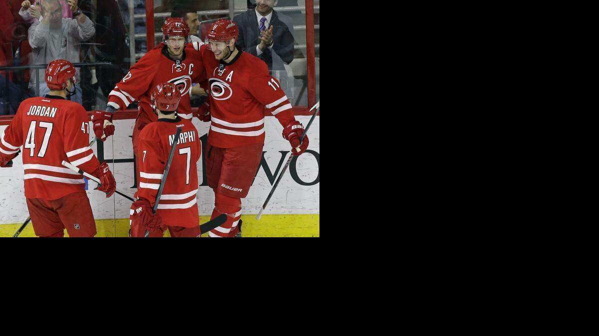
The Canes’ Eric Staal (12) celebrates after he scoring with Michal Jordan (47), Ryan Murphy (7) and Jordan Staal (11) during the third period against the New Jersey Devils at PNC Arena in Raleigh.
