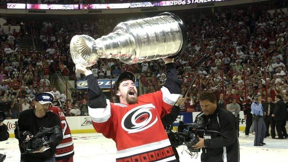 Justin Williams hoists the Stanley Cup at the RBC Center on June 19, 2006.