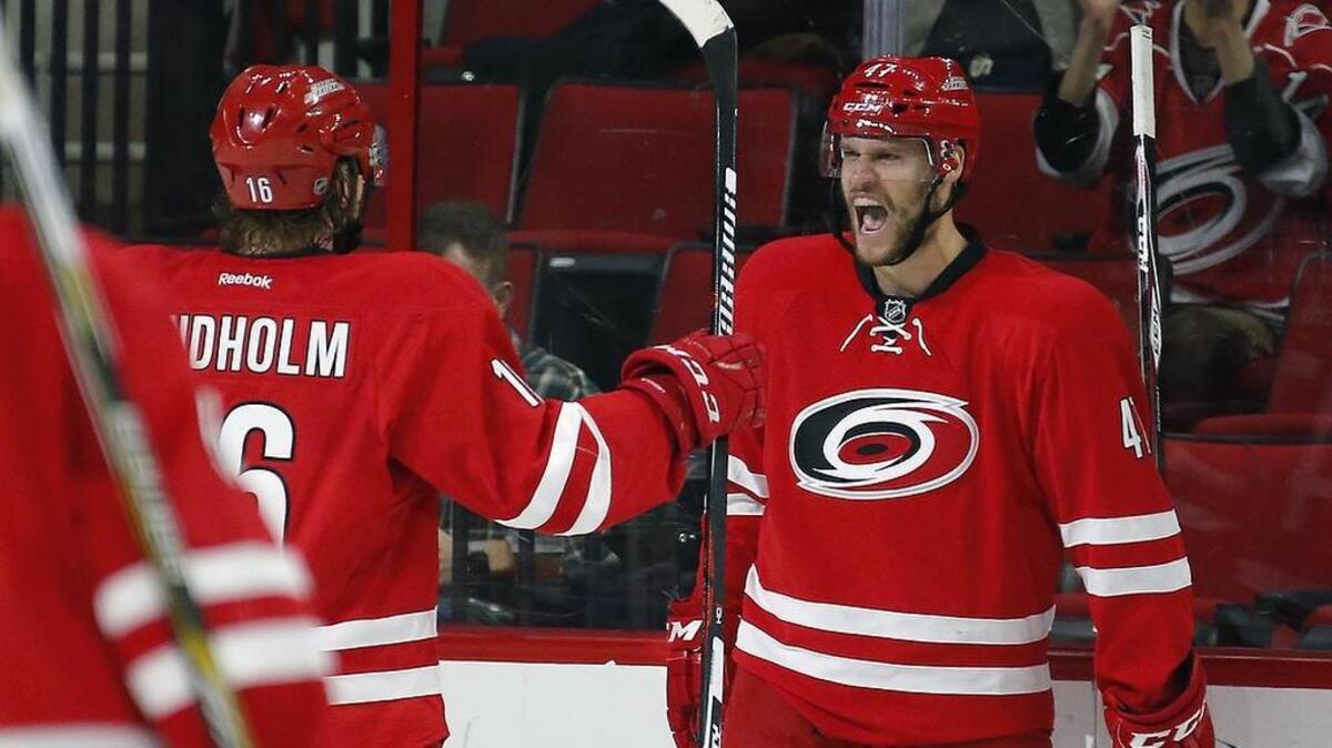 The Carolina Hurricanes’ Michal Jordan (47) celebrates a goal with Elias Lindholm (16) while with Carolina Hurricanes.