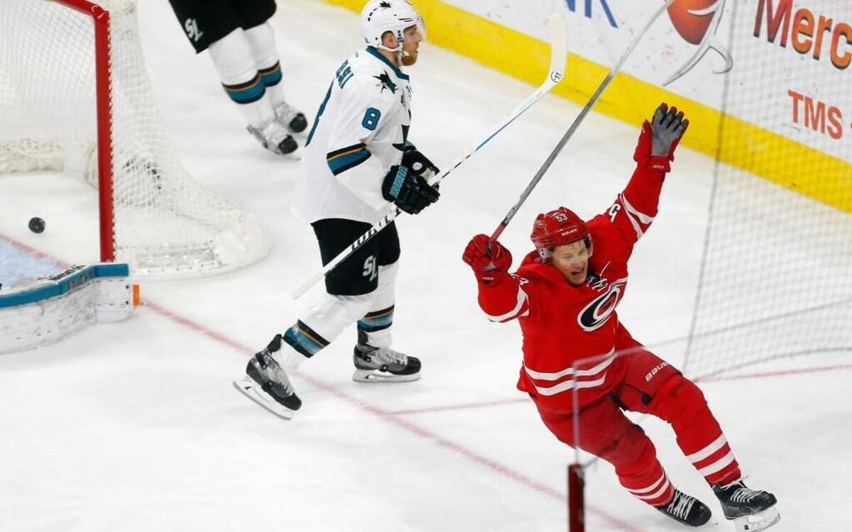Jeff Skinner celebrates after he scored against the San Jose Sharks' Joe Pavelski for his second goal of the night. The Canes beat the Sharks 5-2.