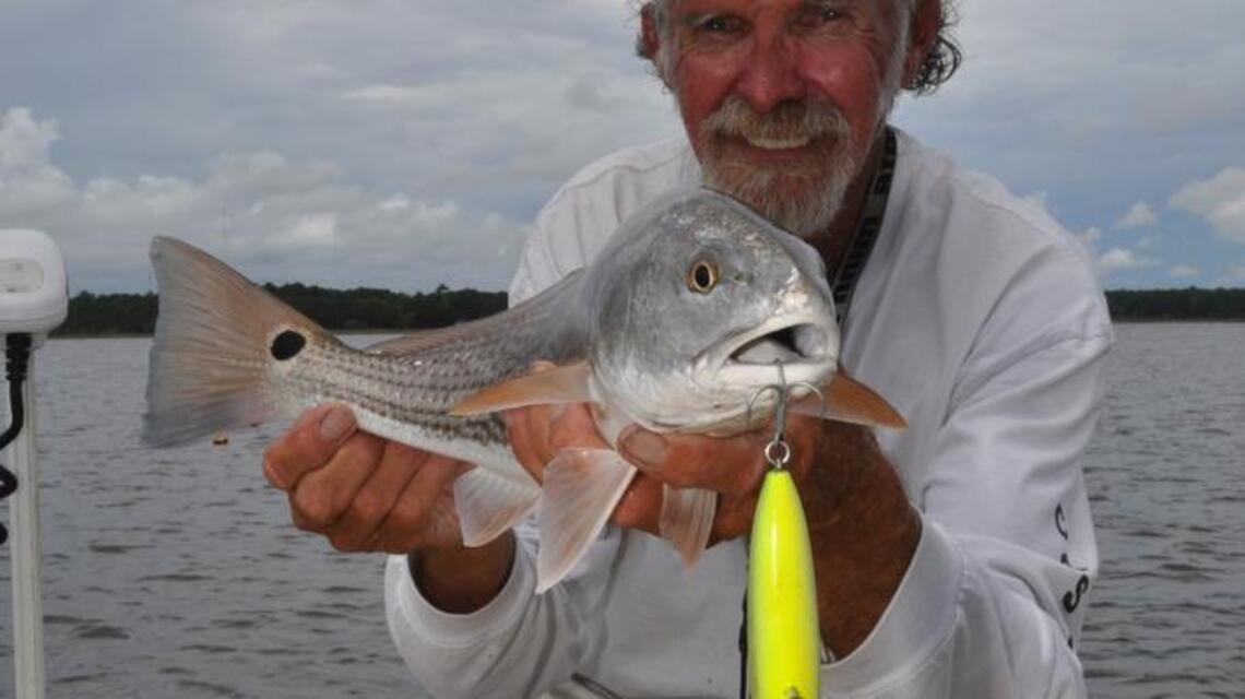 He ignored the thunderstorm clouds and fished for red drum