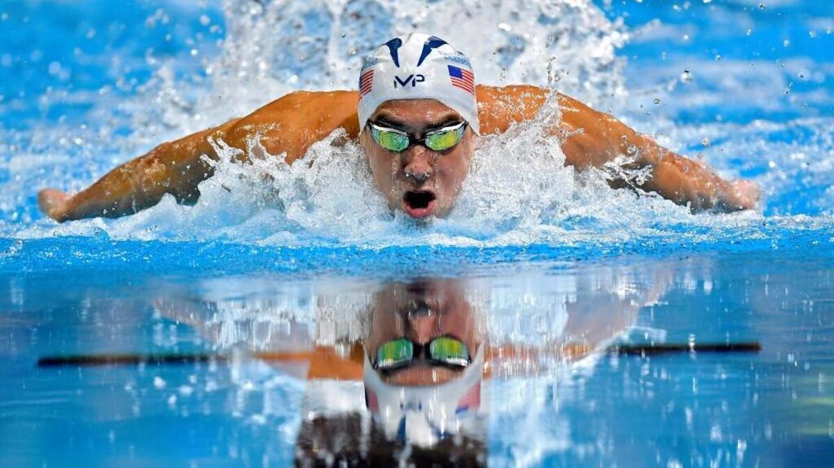 Michael Phelps swims in the men's 100-meter butterfly final at the U.S. Olympic swimming trials, Saturday, July 2, 2016, in Omaha, Neb. Phelps won the race.