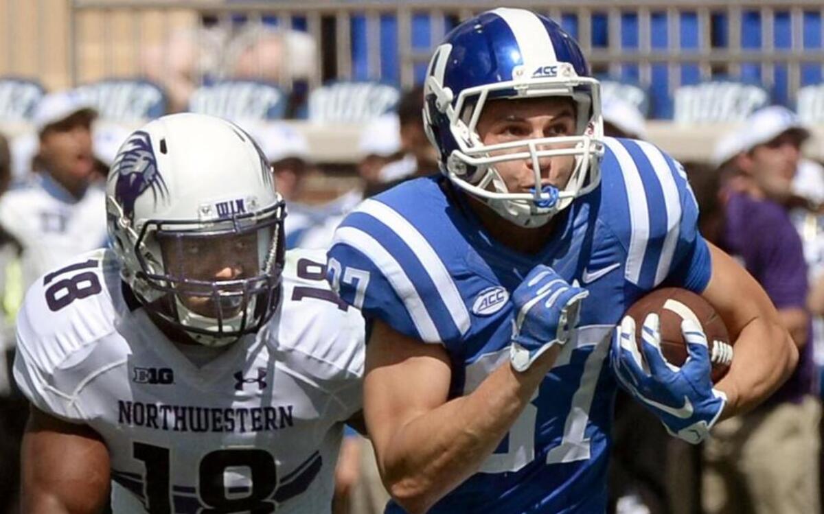 Duke wide receiver Max McCaffrey (87) runs from Northwestern linebacker Anthony Walker (18) during their game at Wallace Wade Stadium at Duke University in Durham Saturday, September 19, 2015.