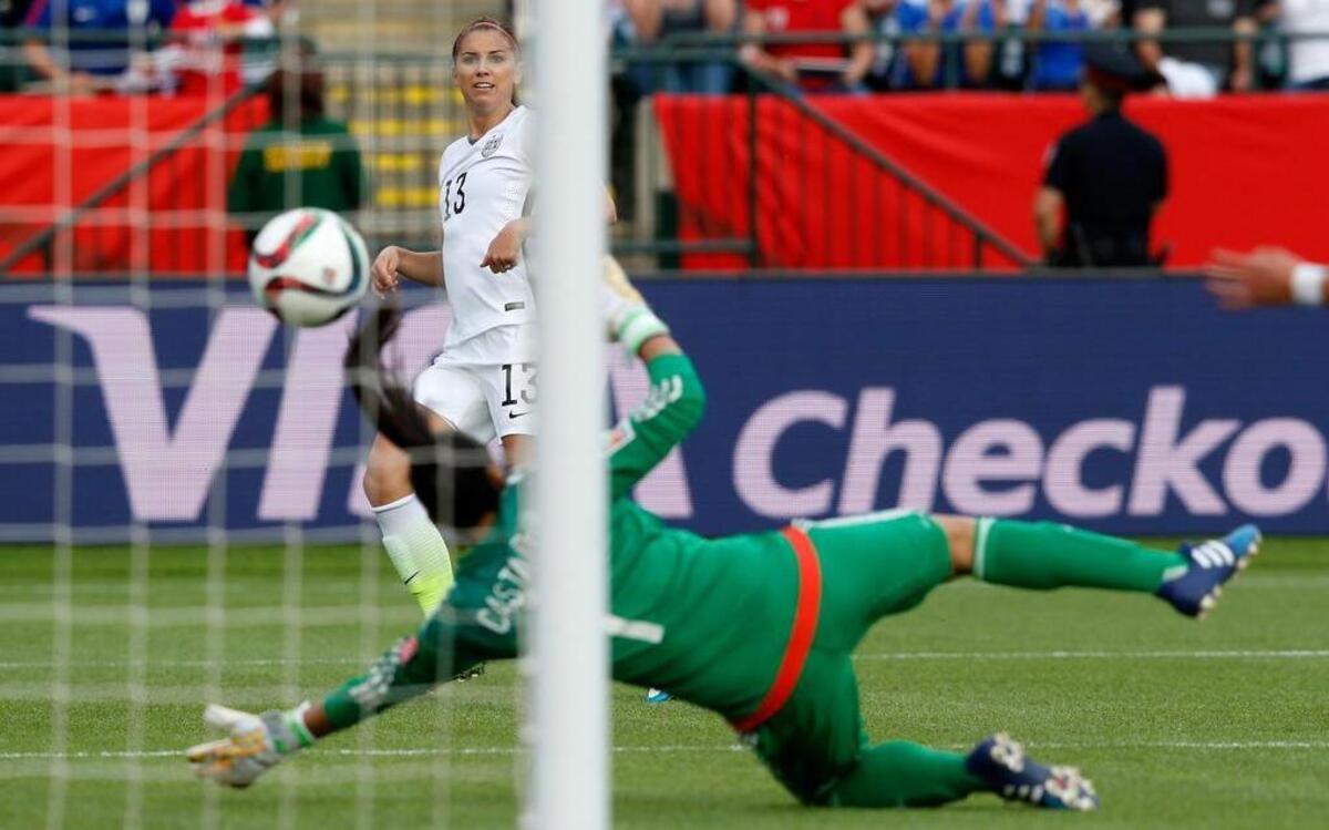 
The U.S’sAlex Morgan scores her first goal against goalkeeper Stefany Castano of Colombia in the second half in the FIFA Women's World Cup 2015 Round of 16 match at Commonwealth Stadium in Edmonton, Canada.
