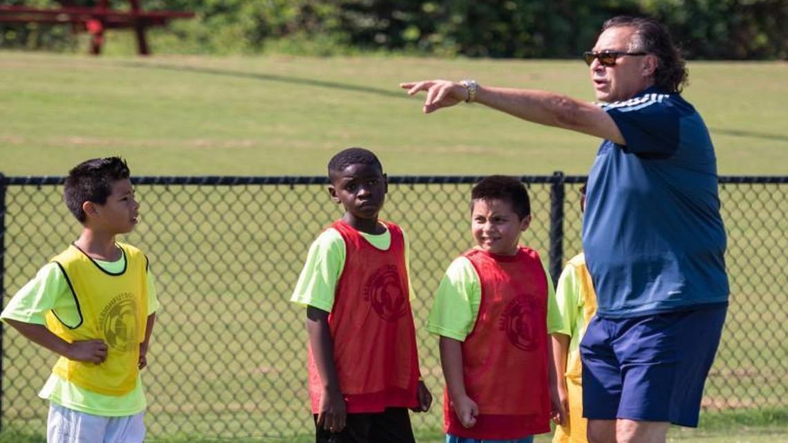 George Tarantini coaches kids at Raleigh Futbol 4 All, a camp founded to help local Latino players get involved in youth soccer, at St. David’s soccer field in Raleigh on July 23, 2016.