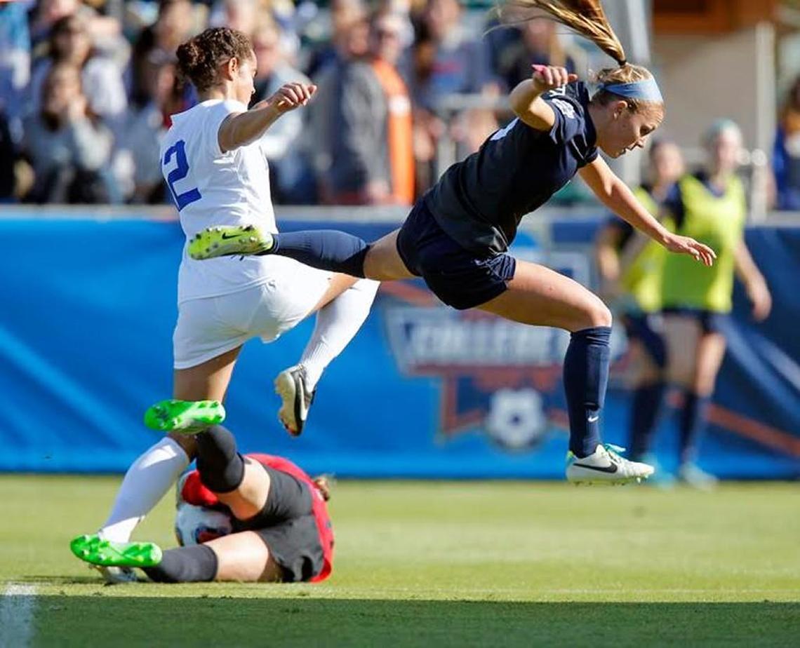 Duke’s Kayla McCoy (12) has her attempt stopped by Penn State’s Frannie Crouse (9) and goaltender Britt Eckerstrom (28) during the first half of the NCAA Women’s College Cup Soccer Finals held at WakeMed Soccer Park in Cary on Dec. 6, 2015.