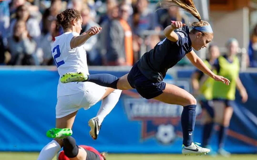 Duke's Kayla McCoy (12) has her attempt stopped by Penn State's Frannie Crouse (9) and goaltender Britt Eckerstrom (28) during the first half of the NCAA Women's College Cup Soccer Finals held at WakeMed Soccer Park in Cary on Dec. 6, 2015.