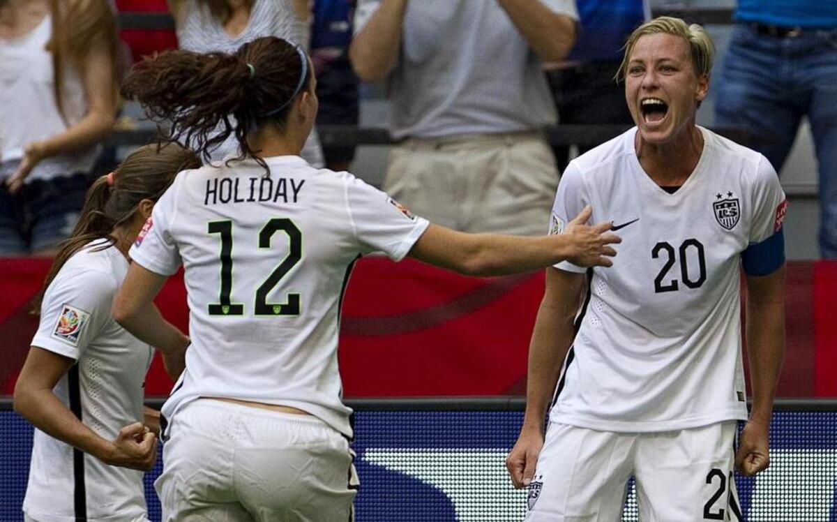 
USA forward Abby Wambach, right, celebrates her goal with teammates Lauren Holiday and Tobin Heath during a group match at BC Place Stadium in Vancouver during the FIFA Women's World Cup Canada 2015 on June 16, 2015. 
