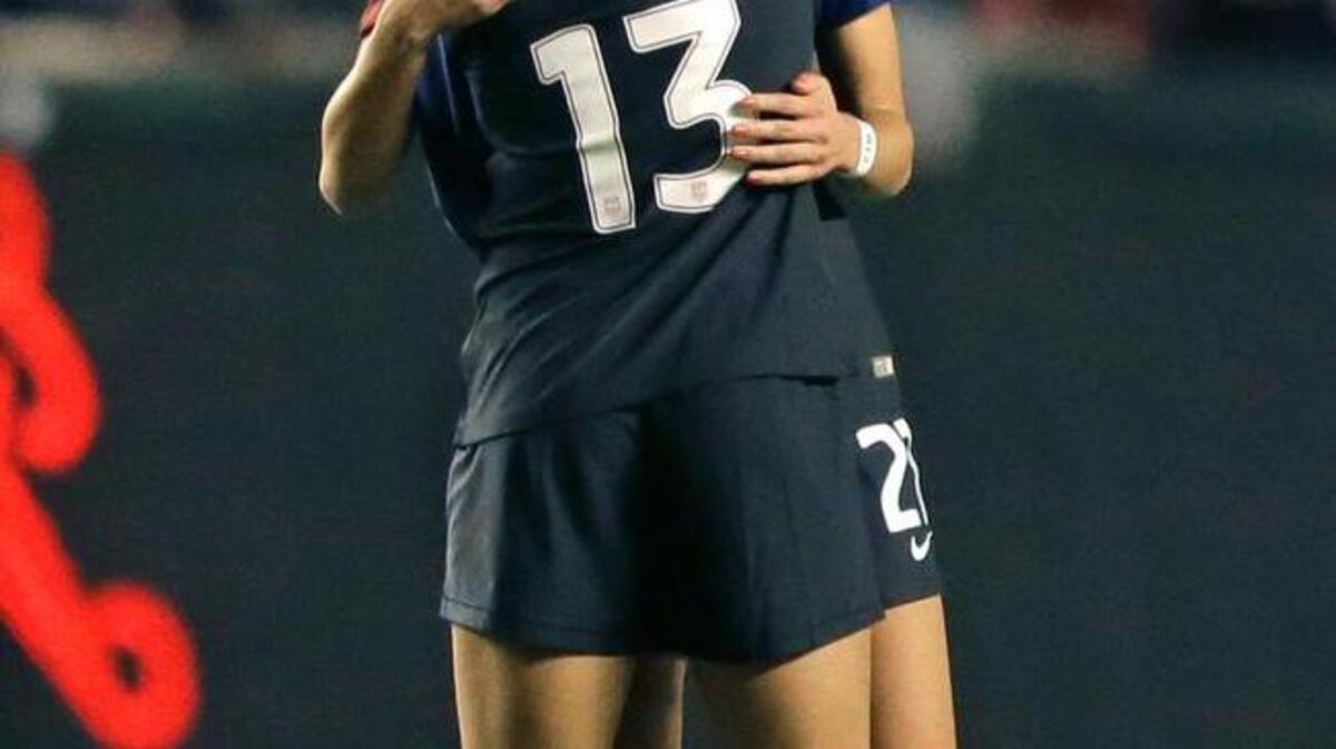 United States’ Lynn Williams (13) receives a hug from teammate Ashley Hatch, rear, following the team's 4-0 win over Switzerland in an international friendly soccer match on Oct. 19, 2016, in Sandy, Utah. (AP Photo/Rick Bowmer)