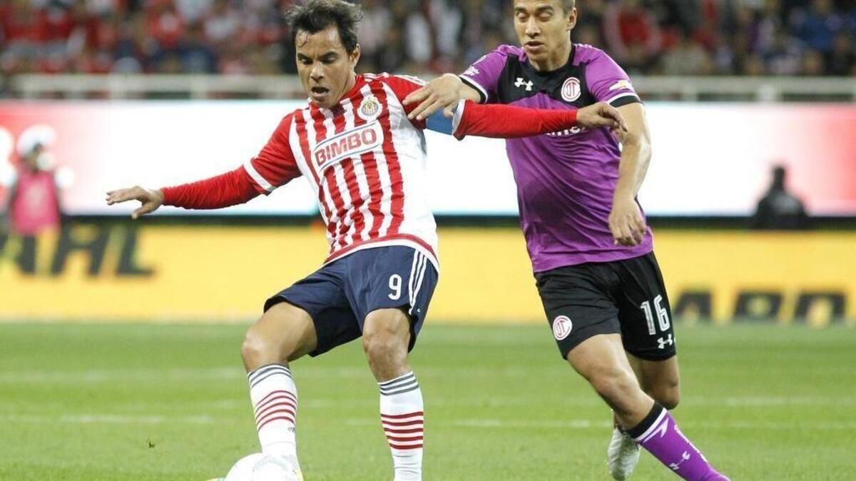 Omar Bravo (left) of Chivas del Guadalajara fights for the ball against Carlos Rodriguez (right ) of Toluca on Saturday Feb. 6, 2016, during for Week 5 of the 2016 Clausura tournament held at the Omnilife Stadium in Guadalajara (Mexico).