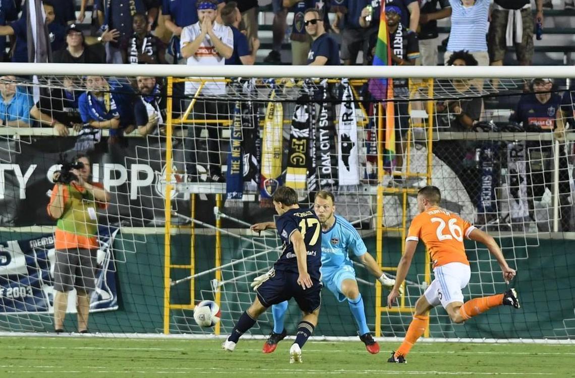 Billy Schuller (17) of North Carolina F.C.takes a shot on goal against goalkeeper Joe Willis, center, and Taylor Hunter (26) of Houston Dynamo at the WakeMed Soccer Park in Cary on June 14, 2017. Houston Dynamo won 3-2 in overtime.