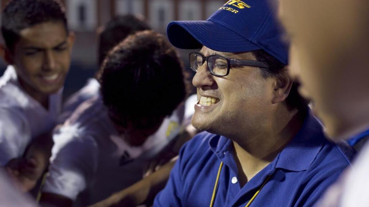 Jordan-Matthews High School soccer coach Paul Cuadros huddles with his players following their 5-2 victory over Eastern Randolph in September 2012. Cuadros led “Los Jets” to the NCHSAA 1A boys soccer championship in 2004, the first predominantly Latino team to win a North Carolina high school title. An exhibit will open Friday, April 1, 2016, at the NC Museum of History that tells the story of “Los Jets.”