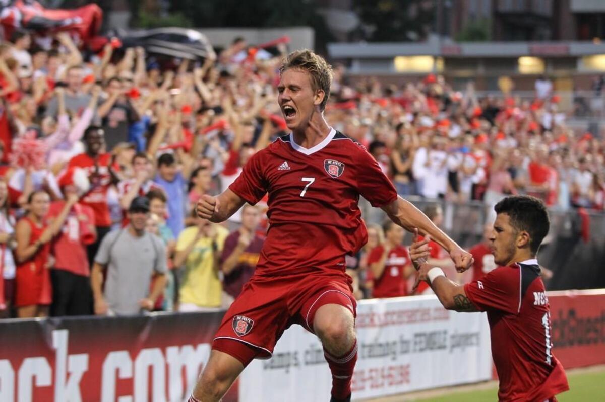NC State's Tanner Roberts celebrates a Wolfpack goal.