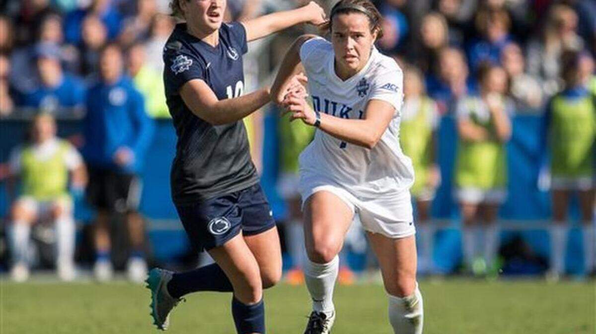 Duke’s Taylor Racioppi (7) and Penn State’s Emily Ogle (10) fight for the ball during the first half of the NCAA Women's College Cup soccer final in Cary, N.C., Sunday, Dec. 6, 2015.
