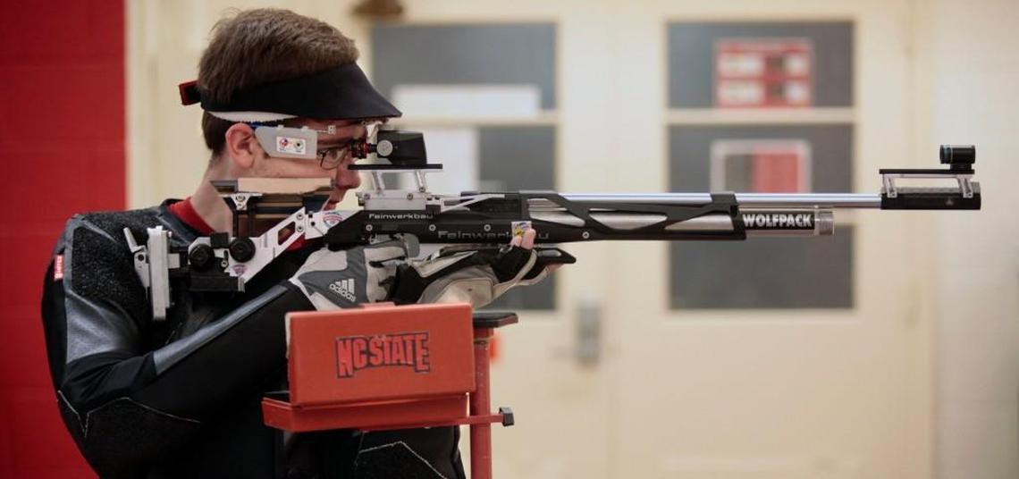 NC State rising senior Lucas Kozeniesky, 21, focuses sharply on his front sight during a practice with his Olympic-grade Feinwerkbau .177 caliber air rifle at the NC State Rifle Team air rifle range.