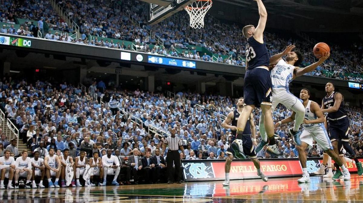 North Carolina’s Joel Berry II (2) drives to the basket against Notre Dame’s Martinas Geben (23) in the Greensboro Coliseum on February 5, 2017. The ACC tournament, often held in Greensboro, will be played at Brooklyn’s Barclays Center starting Tuesday.