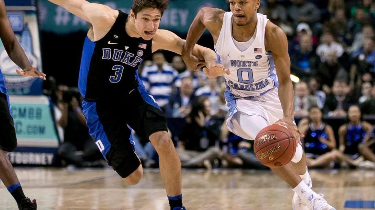 North Carolina’s Nate Britt (0) drives against Duke’s Grayson Allen (3) on March 10, 2017 at the Barclays Center in Brooklyn, N.Y. UNC will play at Duke on March 3, 2018.