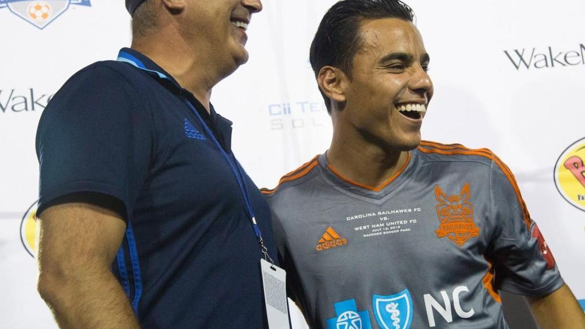 Carolina RailHawks owner Steve Malik, left, introduces Mexican star Omar Bravo as a member of the RailHawks at the WakeMed Soccer Park in Cary, N.C., Tuesday, July 12, 2016.