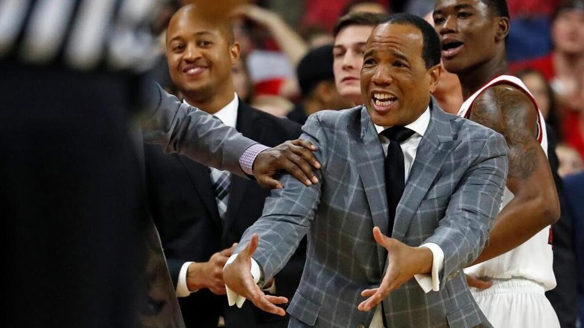 North Carolina State head coach Kevin Keatts protests a call during the second half of an NCAA college basketball game against Miami in Raleigh, N.C., Sunday, Jan. 21, 2018. Miami won 86-81.