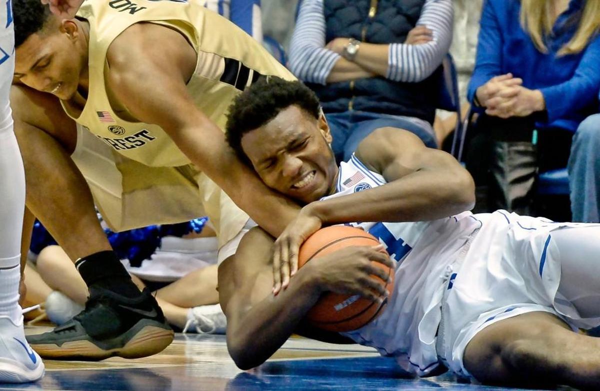 Duke forward Wendell Carter Jr (34) wrestles for a loose ball with Wake Forest center Doral Moore (4) in the second half.