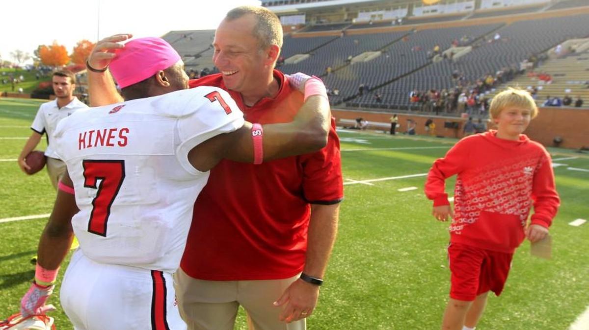 N.C. State coach Dave Doeren hugs Nyheim Hines after Wolfpack's 35-17 victory over Wake Forest at BB&T Field in Winston-Salem.