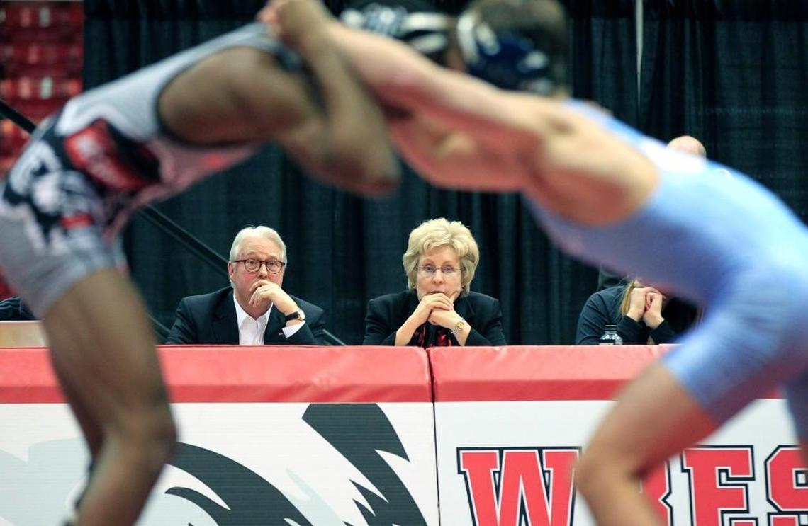 N.C. State Chancellor Randy Woodson and athletic director Debbie Yow watch N.C. State’s Jamal Morris wrestle UNC’s James Szymanski during N.C. State’s match against North Carolina at Dorton Arena in Raleigh on Jan. 25, 2016.
