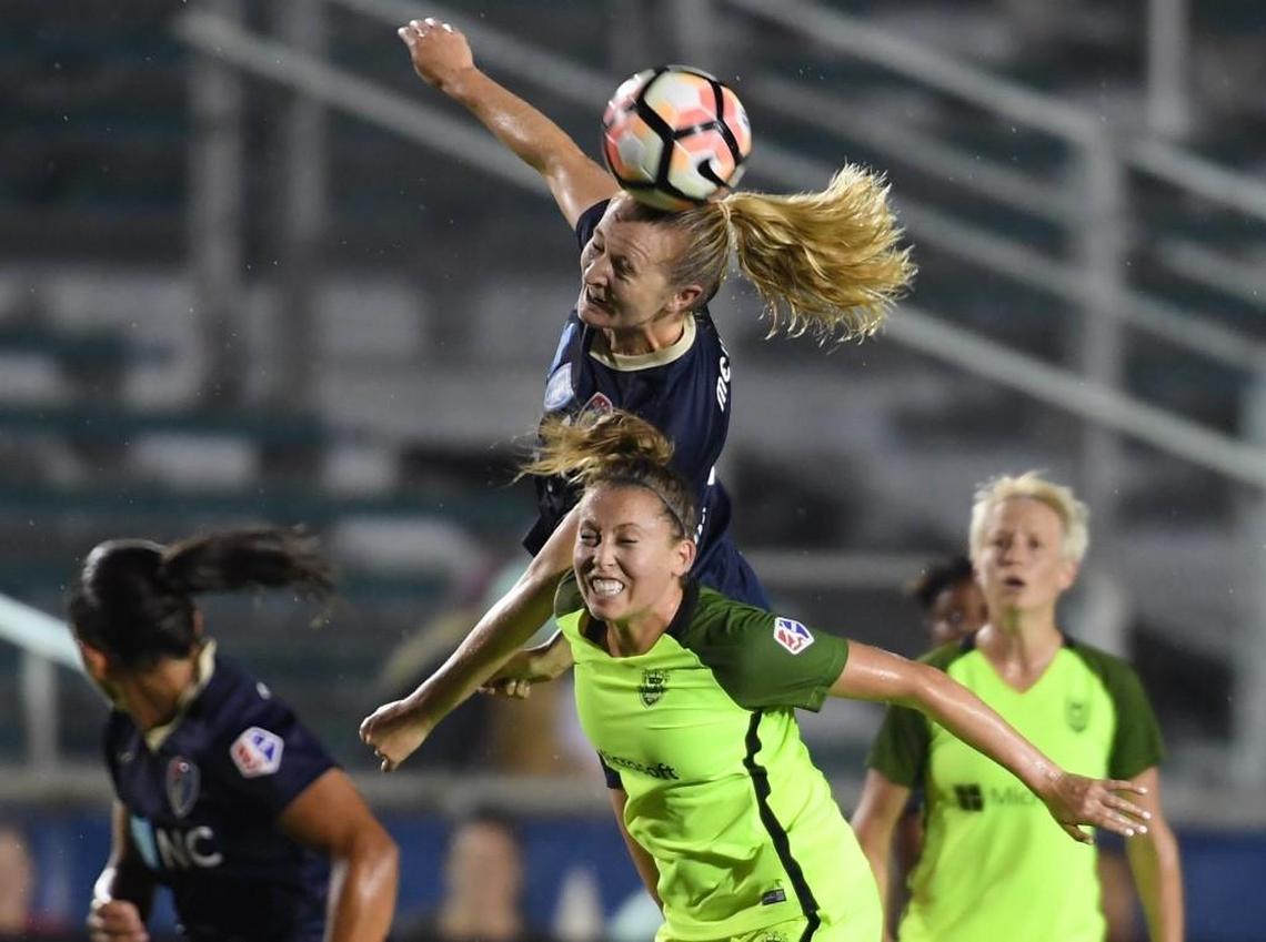 Samantha Mewis, above, of North Carolina Courage wins a header against Lindsay Elston, below, of Seattle Reign. North Carolina Courage played Seattle Reign in a women soccer game that took place at the WakeMed Soccer Park in Cary, N.C. on Saturday, July 8, 2017. North Carolina Courage won 2-0.