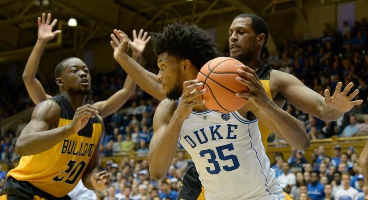 Duke forward Marvin Bagley III (35) moves the ball inside against Bowie State defenders Tai Marshall (15) and Omari George (20) as Duke defeated Bowie State 116-53 in an exhibition game at Cameron Indoor Stadium in Durham on Nov. 4, 2017.