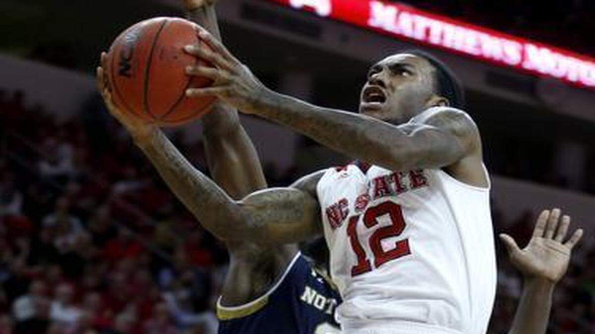 
N.C. State's Cat Barber (12) drives to the basket during the second half of Notre Dame's 81-78 overtime victory over N.C. State at PNC Arena in Raleigh, N.C., Sunday, Jan. 25, 2015.
